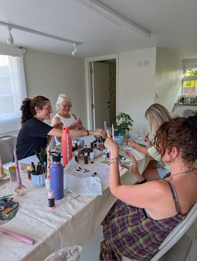 Guests crafting together around the table