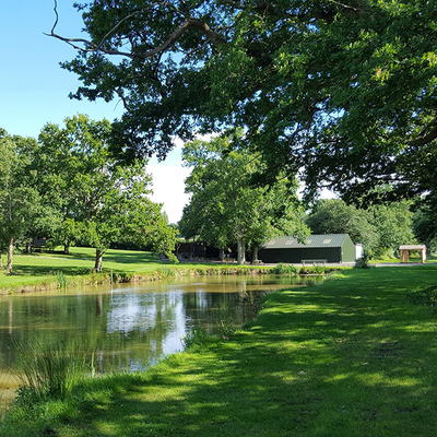 The retreat venue grounds, with a pond and trees