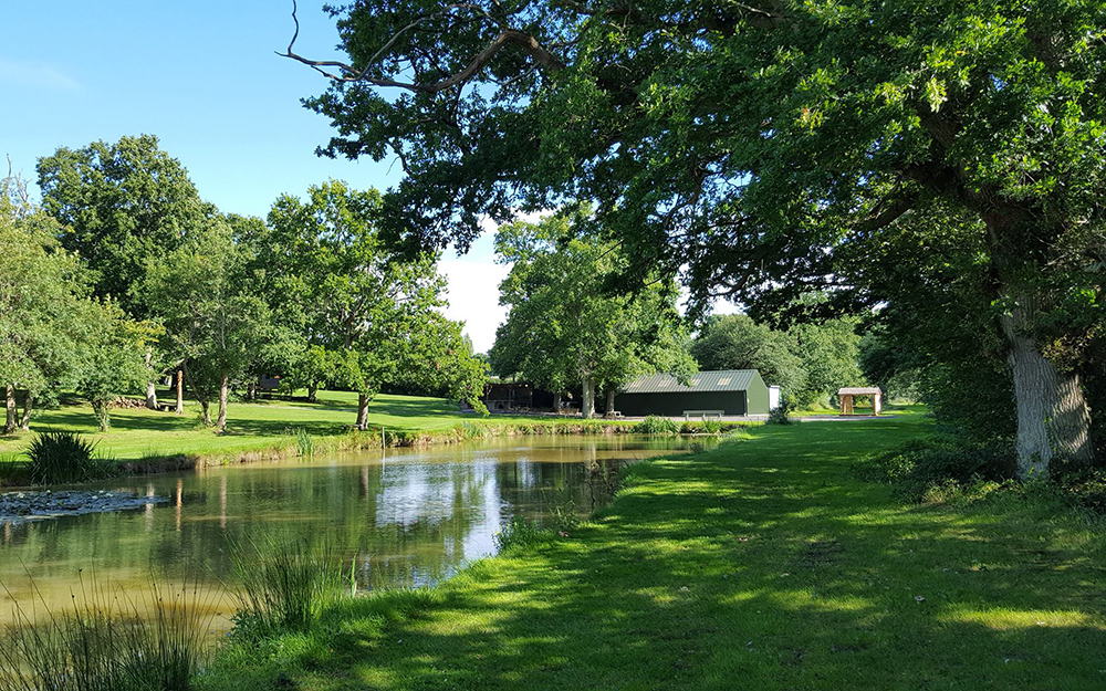 The retreat venue grounds with a pond and trees